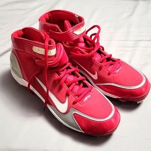 Men's red and white Nike baseball spikes